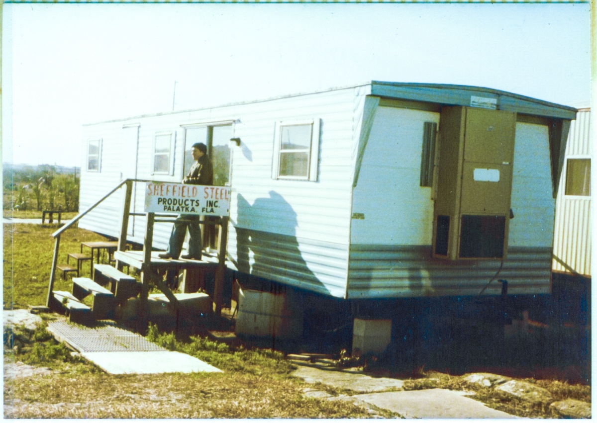 Gene Hajdaj stands in front of the Sheffield Steel field trailer at Space Shuttle Launch Complex 39-B, Kennedy Space Center, Florida. Hajdaj worked for Reynolds Smith & Hills, Architects and Engineers, who designed the structures we were building at the pad.